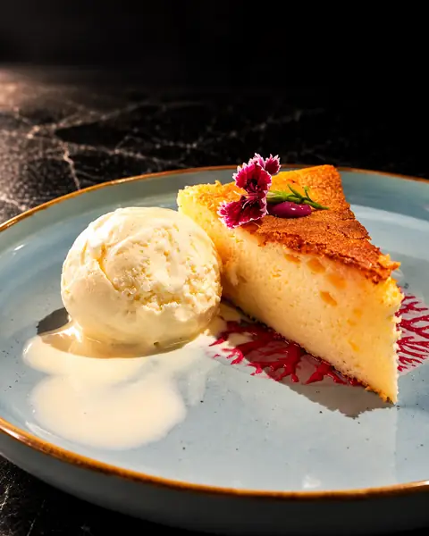 Baked cheesecake with vanilla ice cream