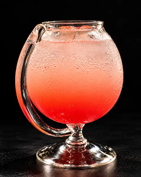 Rose and lychee cooler in a globe glass